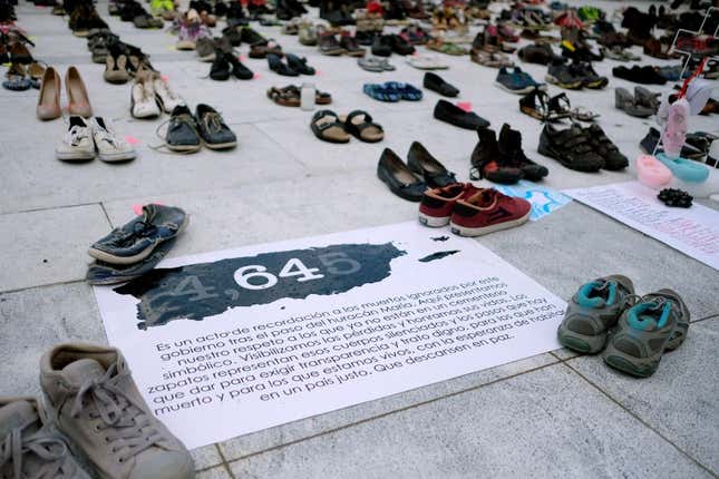 View of displayed shoes in memory of the more than 4,000 estimated deaths caused by Hurricane Maria in front of the Puerto Rican Capitol, in June 2018. U.S. researchers found that deaths were higher than officials had previously reported. 