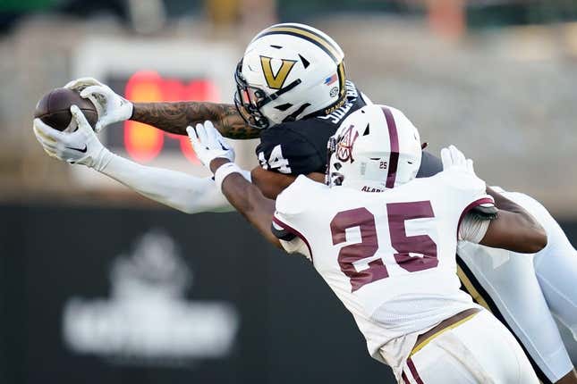 Vanderbilt wide receiver Will Sheppard (14) receives a pass over Alabama A&M cornerback Terphil Bien-Amie (25) during the first quarter at FirstBank Stadium in Nashville, Tenn., Saturday, Sept. 2, 2023.