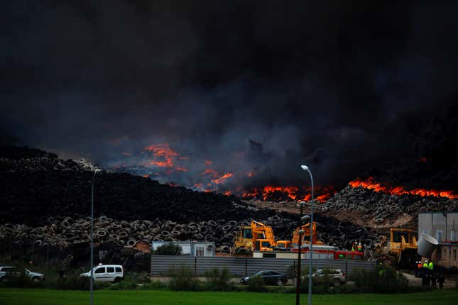 A fire rages at the Sesena dump.