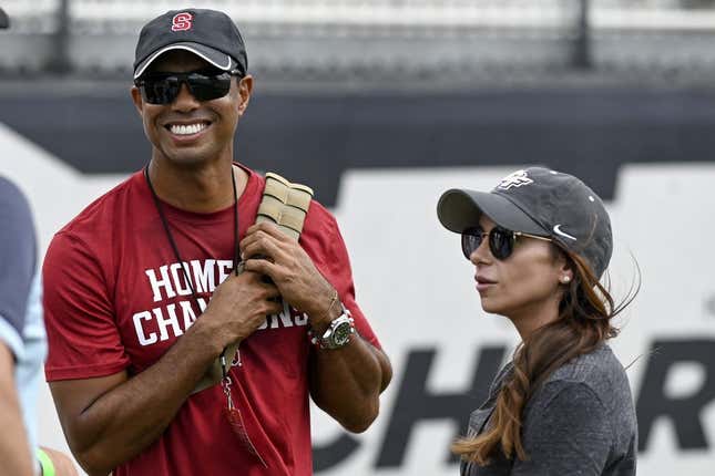 Sep 14, 2019; Orlando, FL, USA; PGA golfer Tiger Woods (red shirt) and girlfriend Erica Herman look on prior to the game between the UCF Knights and the Stanford Cardinals at Spectrum Stadium.