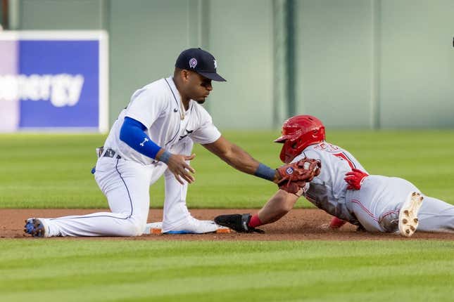 Sep 12, 2023; Detroit, Michigan, USA; Cincinnati Reds first baseman Spencer Steer (7) steals second base and beats the tag by Detroit Tigers shortstop Javier Baez (28) in the first inning at Comerica Park.