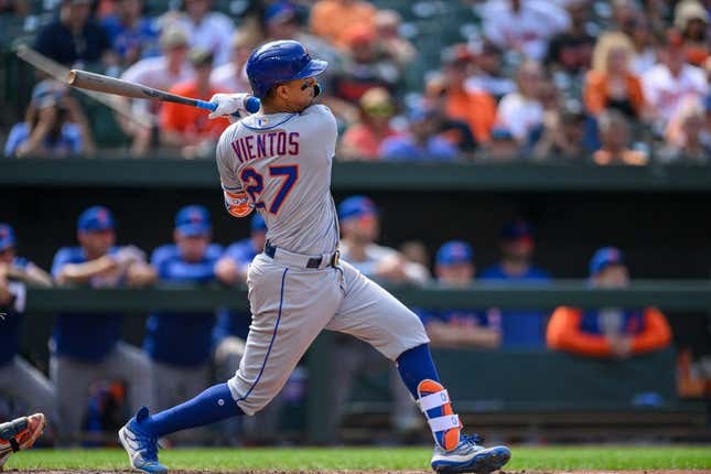 Aug 6, 2023; Baltimore, Maryland, USA; New York Mets third baseman Mark Vientos (27) hits a double during the ninth inning against the Baltimore Orioles at Oriole Park at Camden Yards.