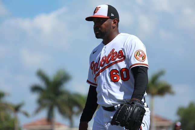 Mar 6, 2023; Sarasota, Florida, USA; Baltimore Orioles relief pitcher Mychal Givens (60) walks back to the dugout after he pitched the fourth inning against the Philadelphia Phillies at Ed Smith Stadium.