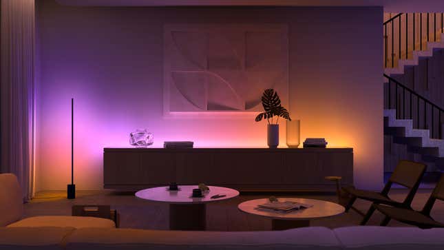 A photo of a room lit up with different Philips Hue smart lights, in purple and yellow arrays