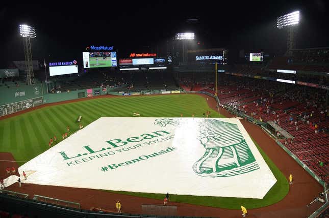 Jul 21, 2023; Boston, Massachusetts, USA;  The Boston Red Sox grounds crew puts the tarp on the field during the fourth inning against the New York Mets at Fenway Park.