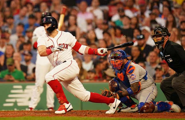 Jul 23, 2023; Boston, Massachusetts, USA; Boston Red Sox center fielder Adam Duvall (18) hits a double to left field to drive in a run against the New York Mets in the third inning at Fenway Park.