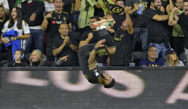 Sep 16, 2023; Los Angeles, California, USA; Los Angeles FC forward Denis Bouanga (99) celebrates after scoring a goal past Los Angeles Galaxy goalkeeper Jonathan Bond (1) off a pass by Los Angeles Galaxy forward Michael Barrios (12) in the first half at BMO Stadium.