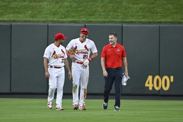 Aug 16, 2023; St. Louis, Missouri, USA;  St. Louis Cardinals center fielder Lars Nootbaar (21) walks off the field with manager Oliver Marmol (37) and a trainer after an injury during the sixth inning against the Oakland Athletics at Busch Stadium.