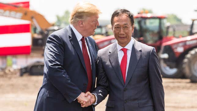 President Donald Trump shakes hands with Foxconn CEO Terry Gou at the “groundbreaking” for the Foxconn plant on June 28, 2018 in Mt Pleasant, Wisconsin