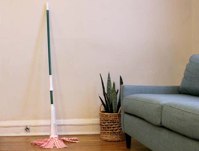 Image for article titled Mop Used to Clean Minor Spill Now Permanent Addition to Living Room