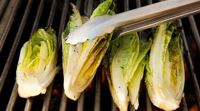 romaine hearts being turned on a grill