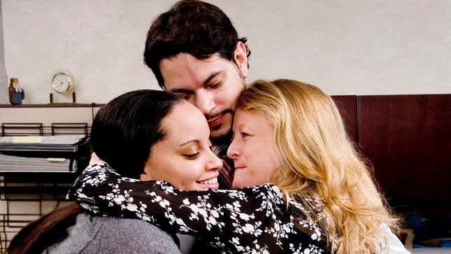 Image for article titled Coworkers Nationwide Embrace Tearfully After Painful 3-Day Separation