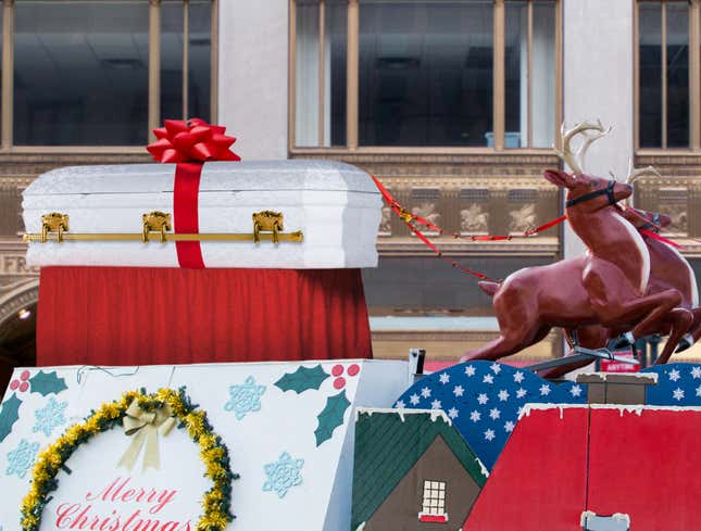 Image for article titled Macy’s Concludes Thanksgiving Day Parade With Traditional Procession Of Santa’s Coffin