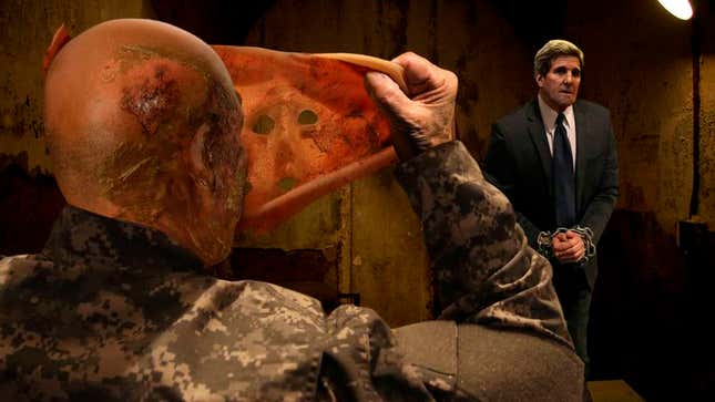 Image for article titled Shackled Kerry Looks On As Chechen Terror Leader Removes Mask To Reveal Scarred Face Of Former Mentor