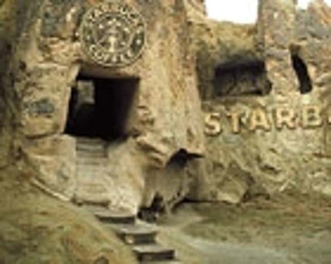 Image for article titled Crude But Functional Starbucks Hewn From Rock Facing