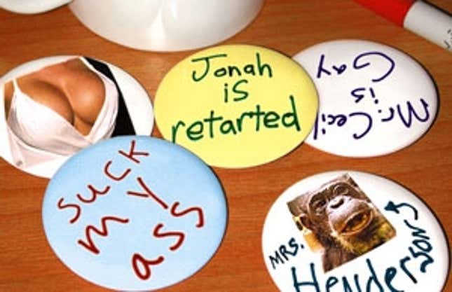 A handful of the confiscated buttons sit on Mrs. Orlowski's desk.