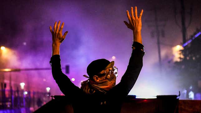 A protester rises his hands up during a demonstration in Minneapolis, Minnesota, on May 29, 2020.