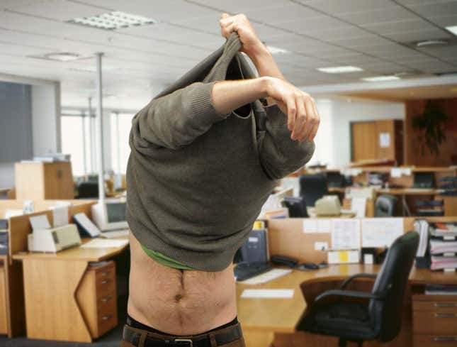 Image for article titled Man Removing Sweatshirt Offers Coworkers Tantalizing Glimpse Of Bare Midriff