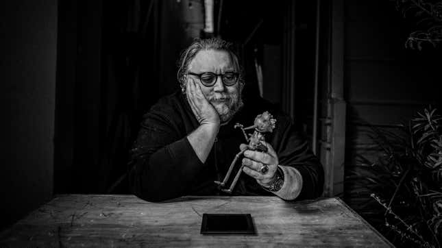 Guillermo del Toro contemplates his puppet pal.