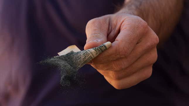 Image for article titled Economists Warn Americans That Money Withering To Ash In Their Hands Could Be Sign Of Recession