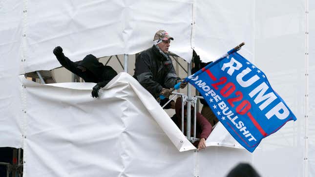Trump supporters are seen outside the Capitol, Wednesday, Jan. 6, 2021,  in Washington. As Congress prepares to affirm President-elect Joe  Biden’s victory, thousands of people have gathered to show their support  for President Donald Trump and his claims of election fraud.