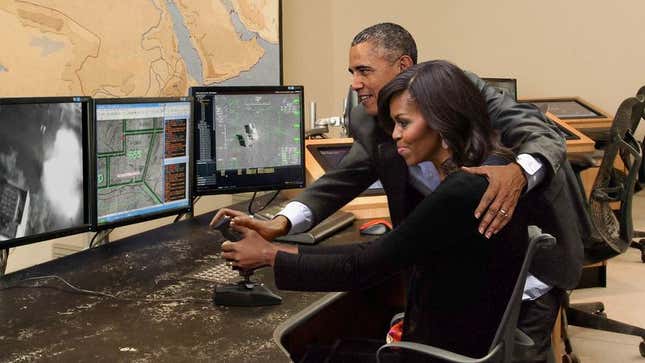 Image for article titled Obama Gently Guides Michelle’s Hand As She Maneuvers Drone Joystick