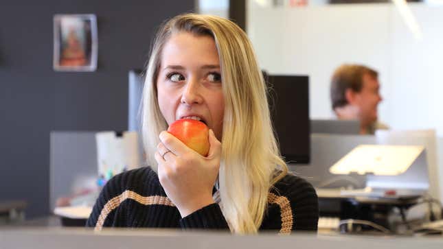 Image for article titled Crack Of Gunfire Resounding Through Office Gives Woman Perfect Cover She Needs To Bite Into Crisp Apple