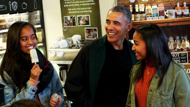 President Barack Obama buys ice cream for his daughters Malia and Sasha at Pleasant Pops during Small Business Saturday on November 28, 2015, in Washington, DC.