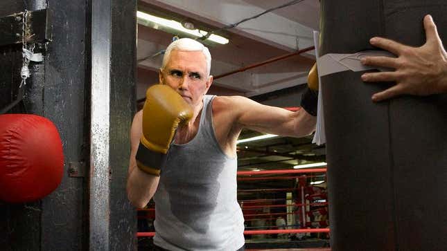Image for article titled Mike Pence Training For Vice Presidential Debate By Hitting Punching Bag With Climate Change Study Taped On Front