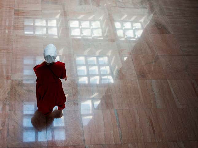 A protester dressed as a character from the novel-turned-TV series “The Handmaid’s Tale” walks into the Senate Hart building on October 4, 2018.