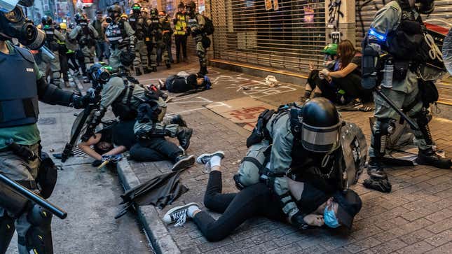 Pro-democracy protesters are brutalized by Hong Kong police in Wan Chai district on October 6, 2019