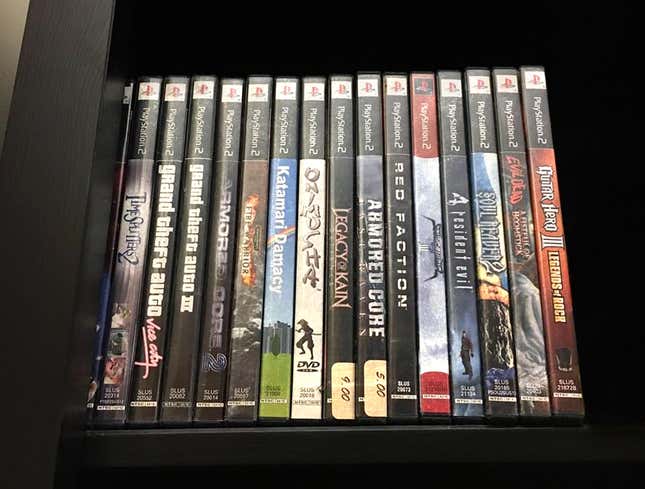 Image for article titled Row Of Dusty PlayStation 2 Games Continues Reign At Top Of Book Shelf