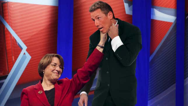 Image for article titled Town Hall Audience Gives Amy Klobuchar Standing Ovation As She Lifts Chris Cuomo Up By Throat