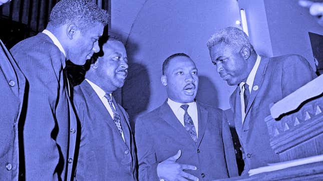 Dr. Martin Luther King Jr. with boxer Floyd Patterson, left, former baseball player Jackie Robinson, right, and civil rights leader Rev. Ralph D. Abernathy, second from left, in 1963.