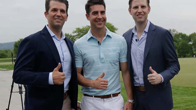 Donald Trump Jr., left, and Eric Trump, right, pose for a photograph with Jesse Watters prior to the start of a news conference previewing the U.S. Women’s Open Championship at Trump National Golf Club, Wednesday, May 24, 2017, in Bedminster, N.J