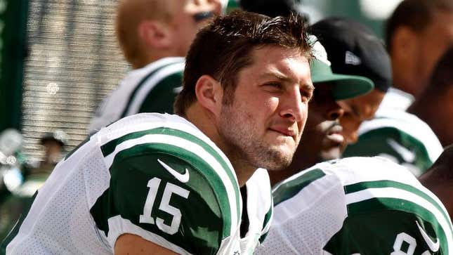 Image for article titled Tim Tebow Puts Empty Gatorade Cups In Wildcat Formation On Jets Bench
