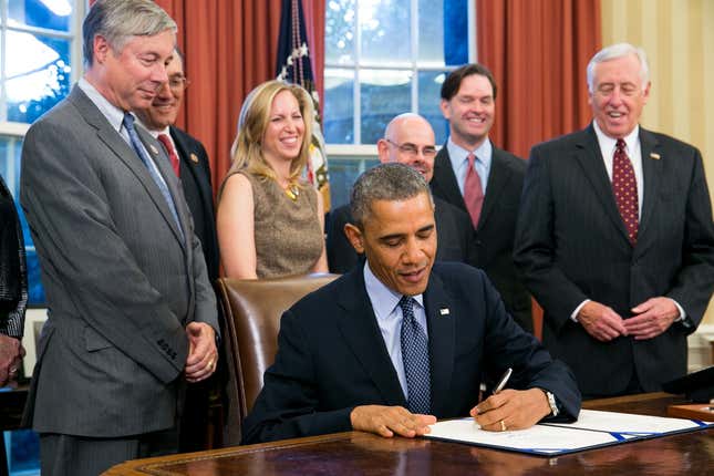 President Barack Obama signs the School Access to Emergency Epinephrine Act (H.R. 2094) in the Oval Office of the White House on November 13, 2013 (Photo by Kristoffer Tripplaar-Pool/Getty Images)
