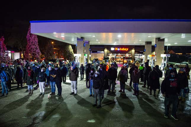 Demonstrators gather at the site of Dolal Idd’s killing in Minneapolis, Minnesota on New Years Eve. 