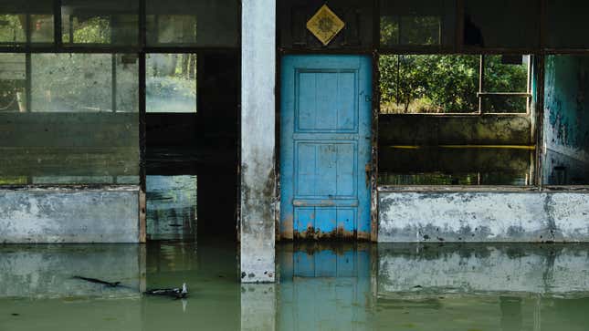 A warehouse sits abandoned after subsidence left it permanently flooded on September 1, 2019 in Jakarta, Indonesia. As much of the northern coastline in Jakarta lies at or below sea level, rain, and floodwater often needs the help of massive pumps to reach the sea.
