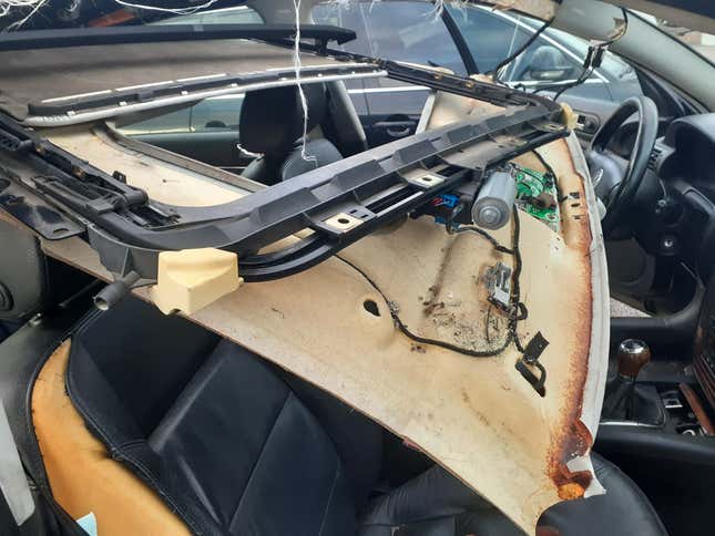Image for article titled How I Fixed A Broken Sunroof In One Of The Most Unreliable Cars Of The Modern Era
