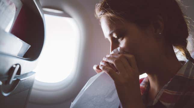 Image for article titled What to Do If You&#39;re Sick on a Plane
