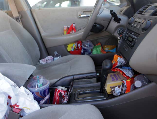Image for article titled Every Conceivable Nook In Car Stuffed With Trash By Second Hour Of Road Trip