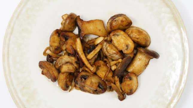 Soy-Wasabi Butter Mushrooms on white plate