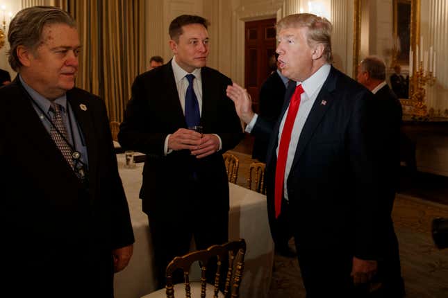 Elon Musk meets with President Donald Trump and White House chief strategist Steve Bannon in the State Dining Room of the White House in Washington on Feb. 3, 2017.