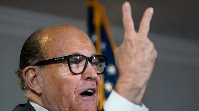 Rudy Giuliani accuses people of voting twice as he speaks to the press about various lawsuits related to the 2020 election, inside the Republican National Committee headquarters on November 19, 2020.