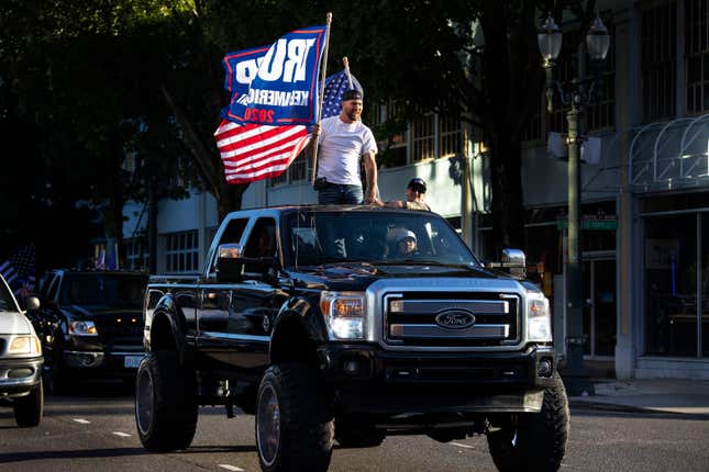 President Donald Trump supporters attend a rally and car parade Saturday, Aug. 29, 2020, from Clackamas to Portland, Ore.
