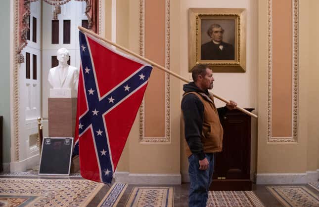 Image for article titled More Capitol Rioters Arrested, Including Man Pictured With Confederate Flag Inside Capitol Building
