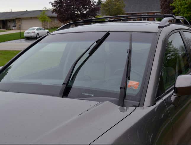 Image for article titled Car Parked With Windshield Wipers Halfway Up Offers Glimpse Of World Suspended In Time