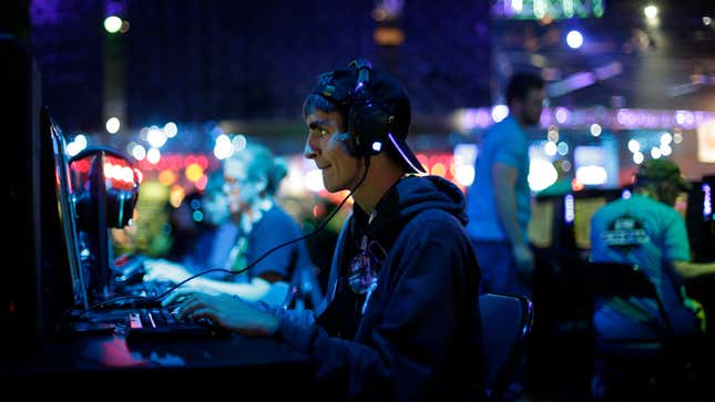 An attendee plays the video game World of Warcraft at the BlizzCon, Friday, Nov. 6, 2015, in Anaheim, California.