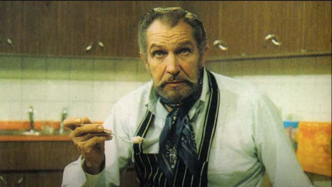 Vincent Price in the kitchen holding a spoon